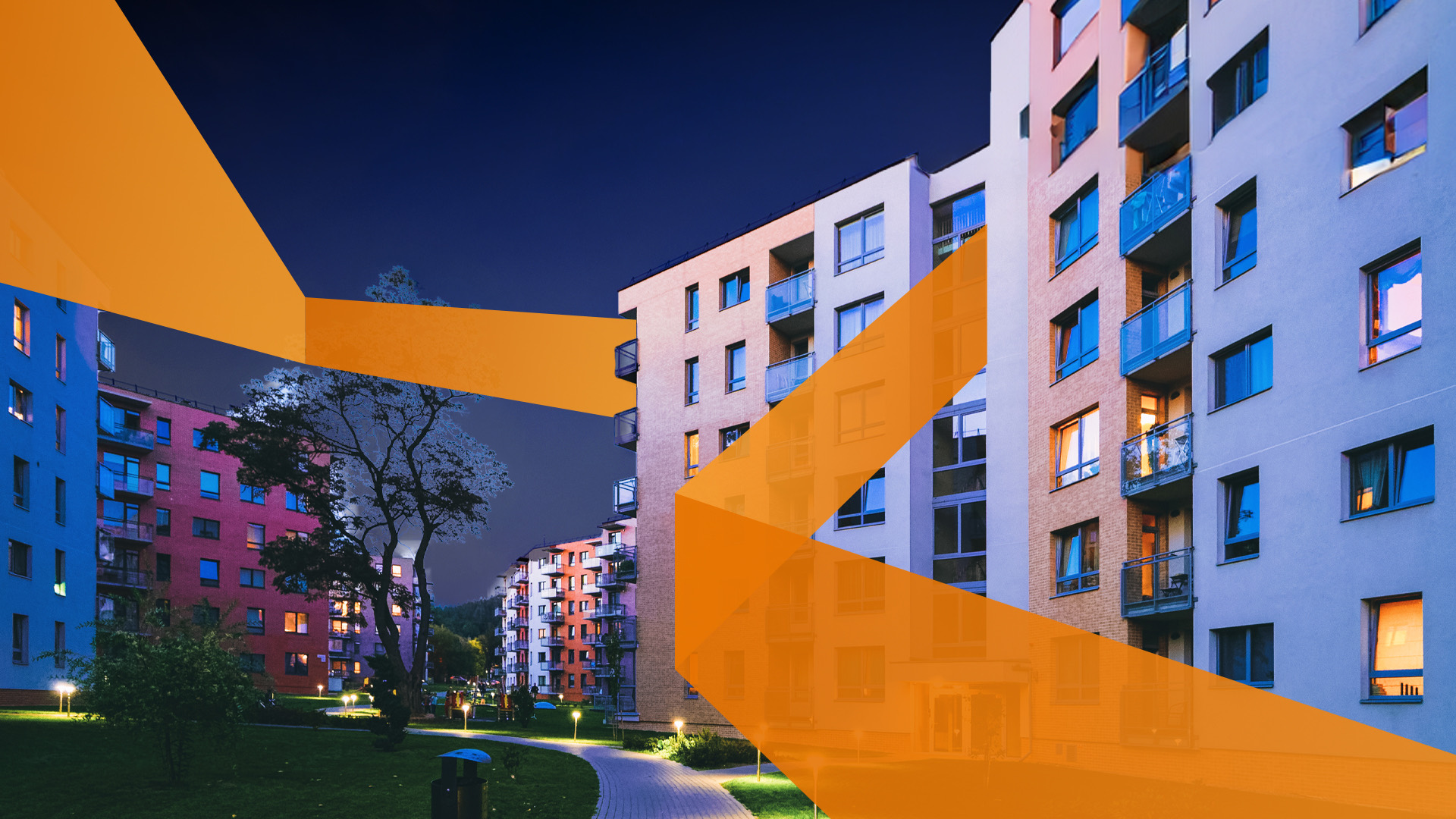 Residential community walkway lit at night