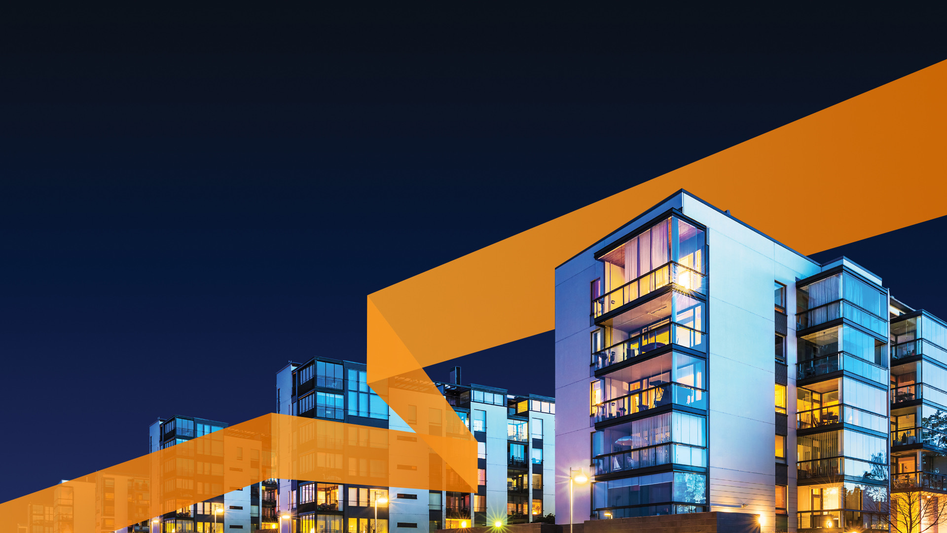 Modern residential buildings lit at night
